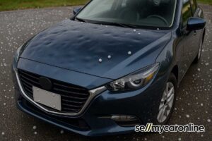 car showing hail damage from a severe storm with golf ball sized hail on car